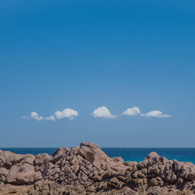 Rocks and clouds at Stokes Bay